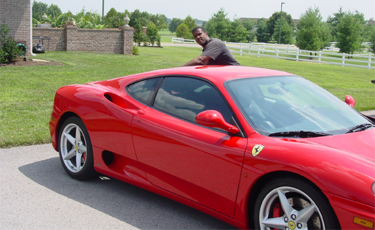 Man Posing with a Red Car